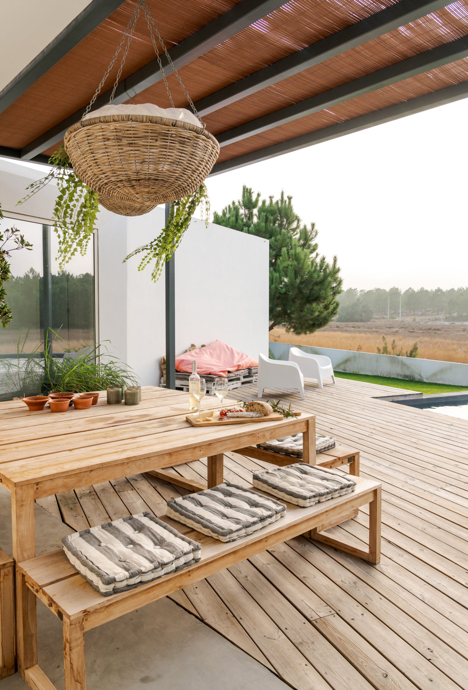 Modern house with garden swimming pool and wooden deck